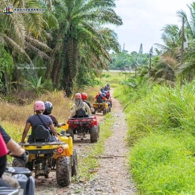 Star Fish Leisure Farm ATV riding through plantation trail